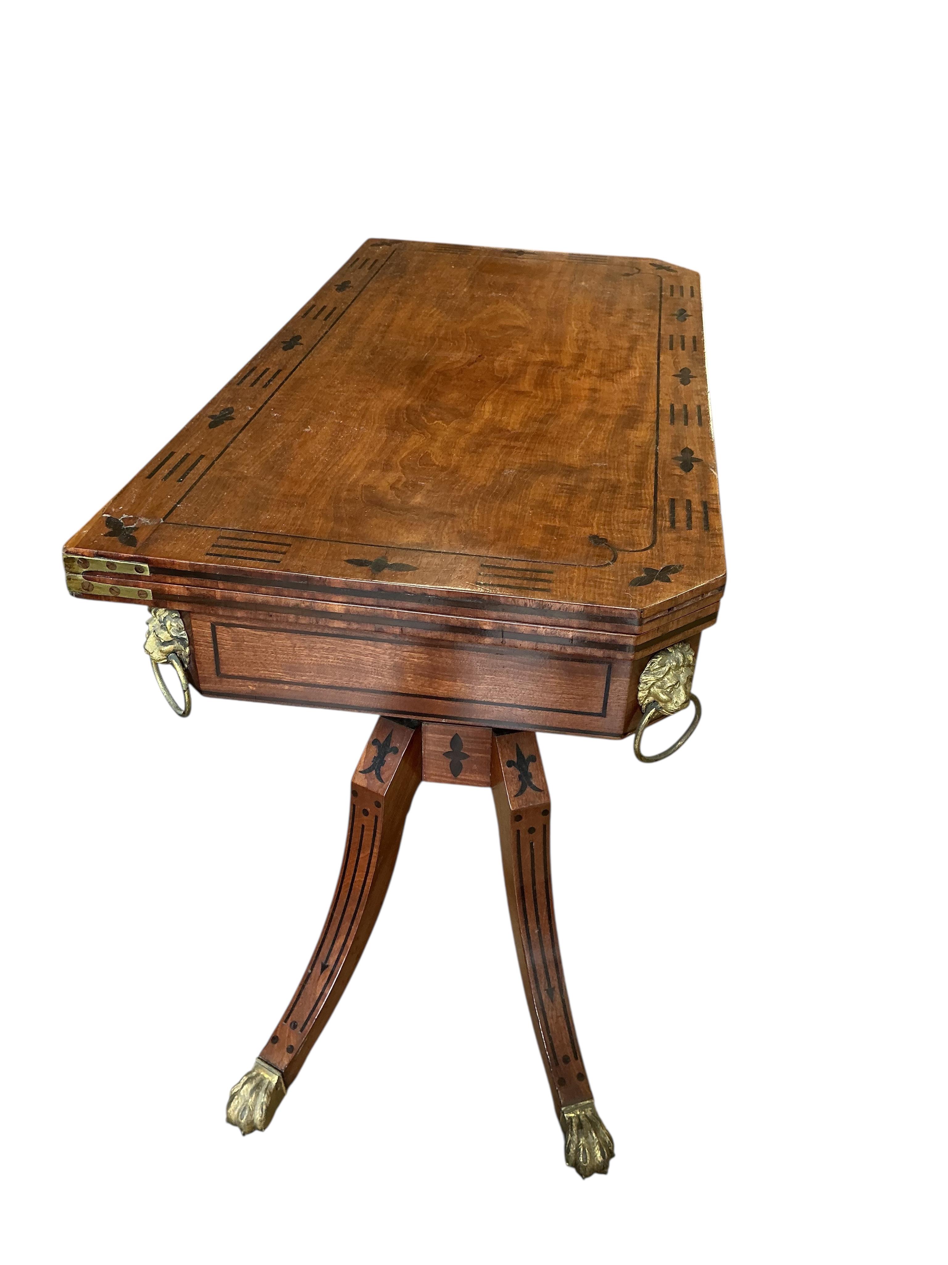 A Regency ebony inlaid rectangular mahogany folding card table, width 91cm, depth 45cm, height 74cm